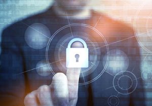 A man touching a digital lock, symbolizing cybersecurity.