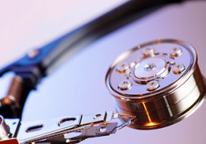 A close up of a part of a hard drive being worked on for data recovery.