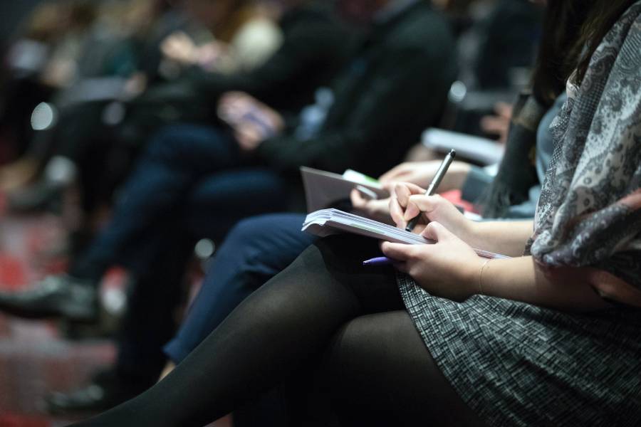 Employees taking notes at a presentation for Boca Raton It Support