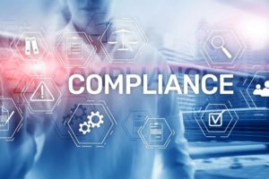 IT professional with graphics overlaid reading "Compliance"