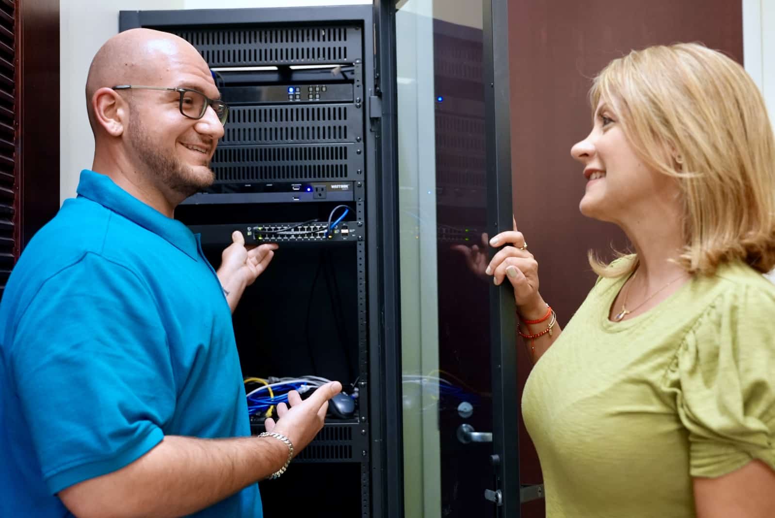 A Blue Light IT team member discussing managed IT solutions with a client.