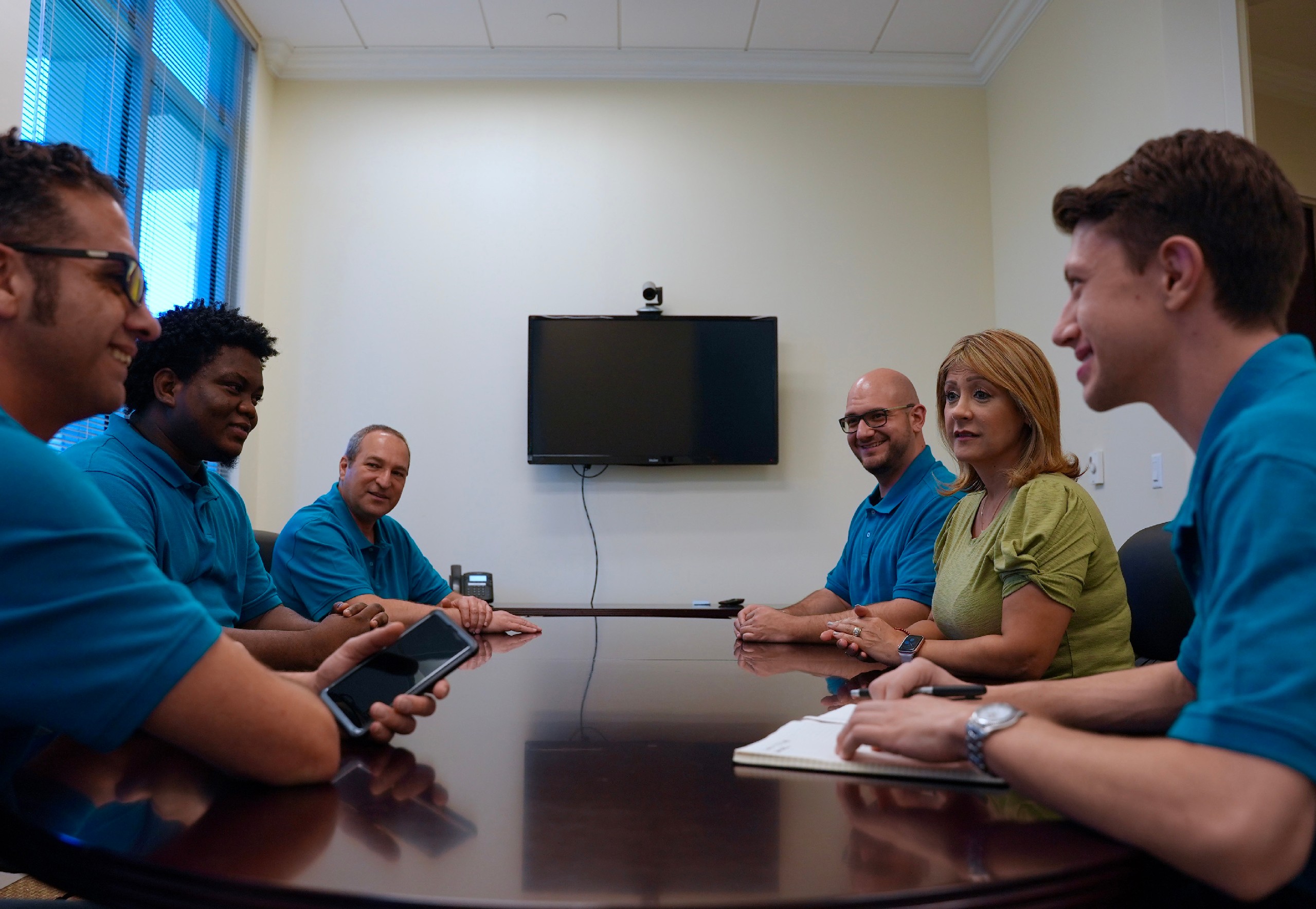 The Blue Light IT team meeting to discuss cybersecurity.