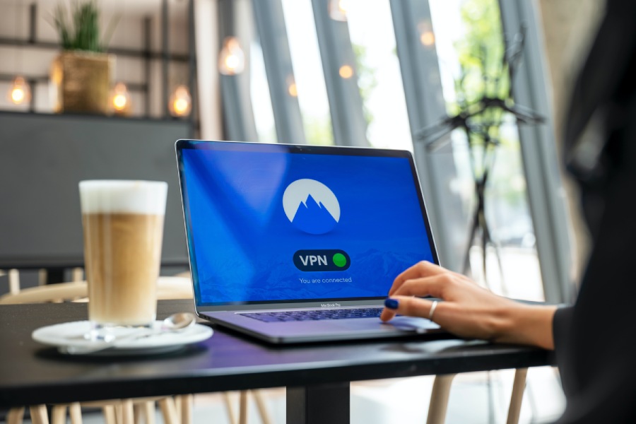 Person using a VPN at a Coffee shop